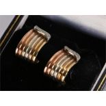 Pair of 9 carat gold earrings, with three colour gold lines, 4.4 grams