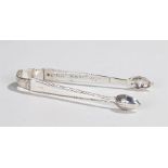 Pair of Georgian silver sugar tongs, with acorn form terminals, inscription to inside of arm "G R