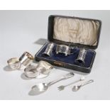 Silver, various dates and makers, to include a cruet set, a spoon, a fork and three napkin rings, (