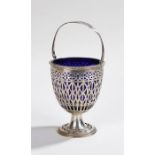 Dutch silver basket, import mark for London 1907, with pierced swing handle and body with blue glass