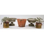 Garden urns, to include two red clay examples, another and a pair of composite examples (5)