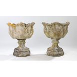 Pair of composite garden urns, with acanthus leaf decoration 59cm high, (2)