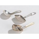 Three silver caddy spoons, to include an example by Elizabeth Morley, London 1800, the next by