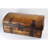 Early 19th Century leather clad trunk, the arched top with iron fittings, stud work decoration, 62cm