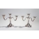 Pair of silver plated two branch candelabra, circa 1940's, with a central beam flanked by the lappet