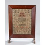 19th Century needlework sampler firescreen, the sampler with central depiction of a country house