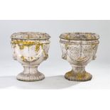 Pair of composite garden urns, in the Regency taste, of urn form with rope decoration, 42cm high, (