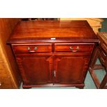 Reproduction mahogany side cabinet, two frieze drawers above two cupboard doors, 77cm wide