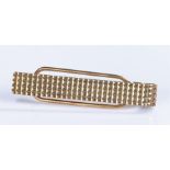 9 carat gold tie clip, with a geometric bar and sprung back, 6 grams