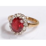 9 carat gold ring, set with a red stone, ring size J