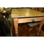 Pine dining table with frieze drawer on turned legs, 114cm by 76cm