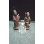 Two cast metal Chinese figures,the tallest being 19 cm, together with an engraved perfume bottle, (