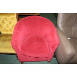 Tub chair upholstered in a red fabric