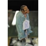 Chinese porcelain figure, depicted wearing a turquoise robe, impressed mark to base, 18.5cm high