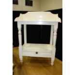 White painted washstand with three-quarter splash back above turned supports and a drawer to the