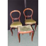 Pair of Victorian mahogany balloon back dining chairs, together with a mahogany foot stool, (3)