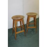 Two oak stools, with oval seats and straight legs, (2)