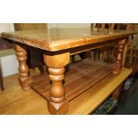 Pine coffee table on turned legs united by a flattened undertier, 106cm by 61cm