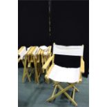 Four folding directors chairs, (4)