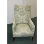 Late Victorian upholstered armchair, on square tapering legs and castors