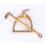 9 carat gold pendant, of a crop and stirrup, 1.2 grams