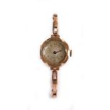 9 carat gold cased ladies wristwatch, the dial with Arabic numerals, manual wound, on a 9 carat gold