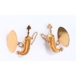 Pair of yellow metal Saudi Arabian cufflinks, with a khanjar and disc to each link, 6.8 grams