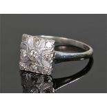 18 carat white gold and diamond set ring, the square head set with nine diamonds, ring size L