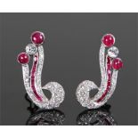 Fine pair of diamond and ruby earrings, set with an estimated 3.8 carat of cabochon and baguette cut