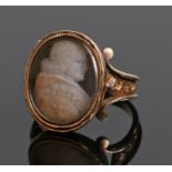 19th Century ring, with a carved image of Pope Pius VII to the oval head with scroll shoulders