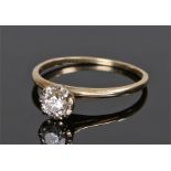 14 carat gold diamond set ring, the round cut diamond set in a four claw mount, ring size N