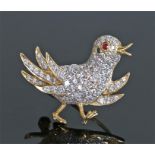 18 carat gold diamond and ruby brooch, as a chick in running position, with a diamond covered body