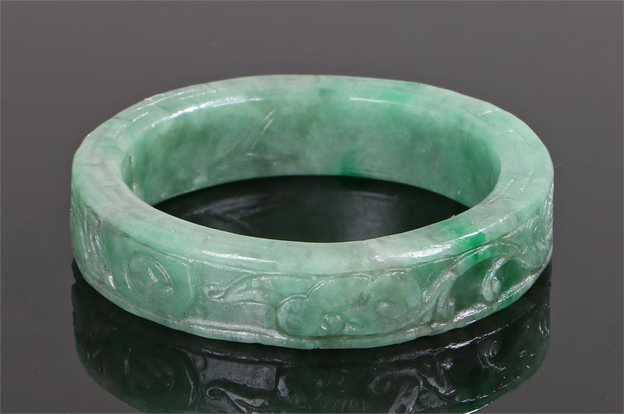 Jade bangle, carved with leaf scrolls, 7.5 diameter