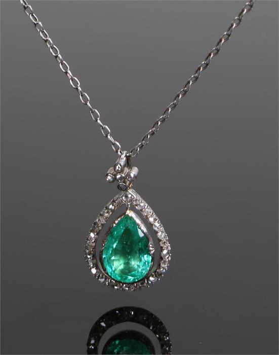 Columbian emerald and diamond set pendant necklace, the Columbian emerald pear cut at 4.03 carats