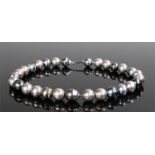 Tahiti pearl necklace, with a row of pearls and a silver clasp, the pearls approximately 16mm