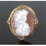 Victorian cameo brooch, of large proportions, the carved figure with a bonnet, housed within a