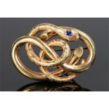Sapphire snake brooch, the head of the snake set with a sapphire above the winding coiled body, 60mm