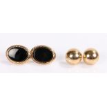 Two pairs of 9 carat gold earrings, the first as domes the second set with black stones, total