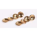 Pair of 9 carat gold earring, each with a row of four discs, 2.1 grams