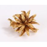 9 carat gold flower brooch, as a flower head and stem, 4.4 grams