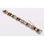 Scottish agate set bracelet, with a row or semi circular agates to the white metal links, 19.5cm