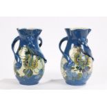 Pair of Baron of Barnstaple art nouveau pottery vases, each with shaped necks, triple pierced wavy