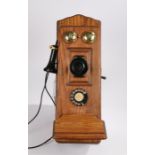 Early 20th century style wooden cased wall mounted telephone, with mouth piece to the left hand