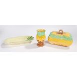 Beswick to include an art deco biscuit barrel and cover decorated in yellow, green and brown, a vase