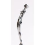 Chrome car mascot, in the form of a female nude with her hands clasped behind her back, 18cm high