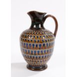 Royal Doulton jug, with loop handle, the bulbous body with brown and blue scale type decoration,