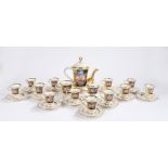 Capodimonte coffee service, decorated with floral sprays on a green and black background, with