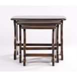 Nest of three Ercol dark oak table, on pierced end supports, the largest table 56.5cm wide