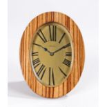 Asprey desk clock, the signed gilt dial with roman numerals, housed in an olive wood and brass