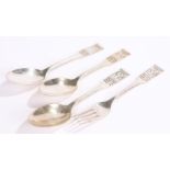 Three Danish silver dessert spoons and a matching dessert fork, two spoons dated 1936, the other